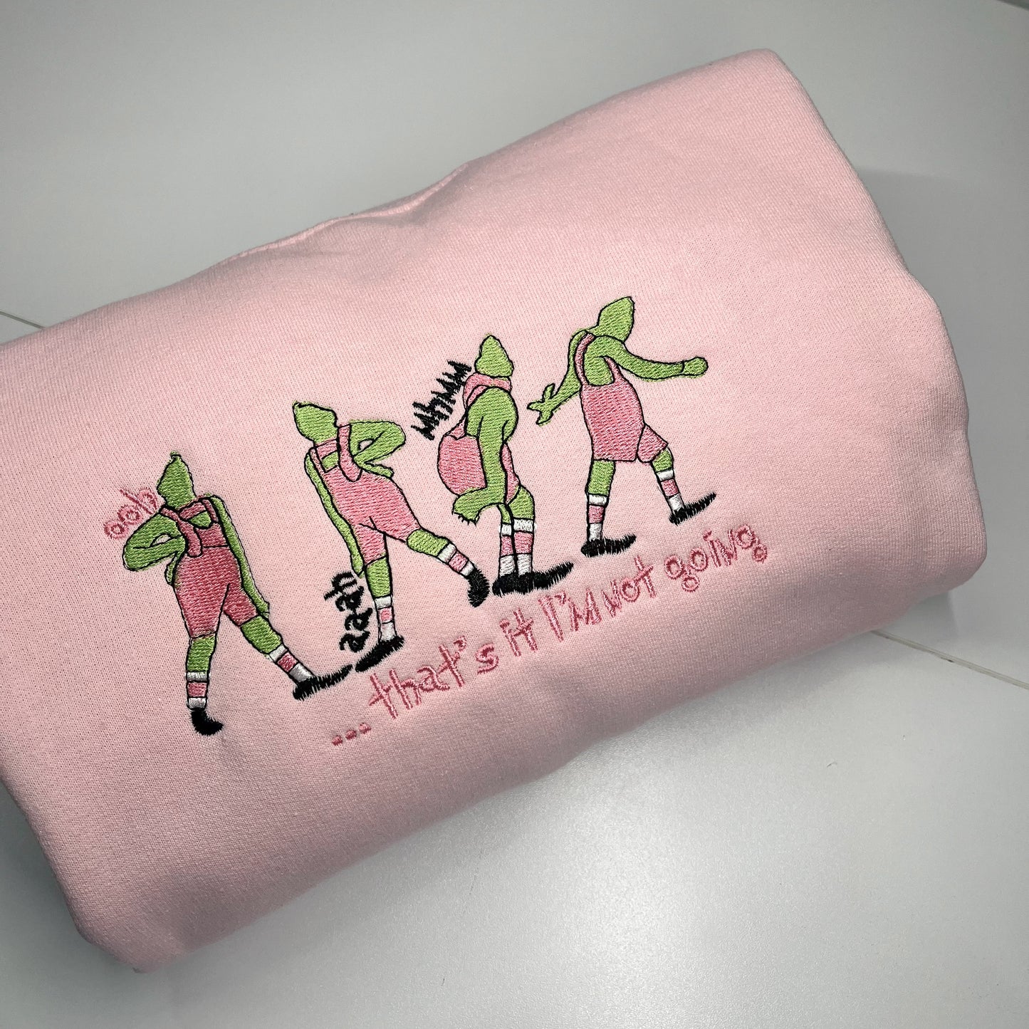 Green Sly Christmas Guy in Pink Crewneck